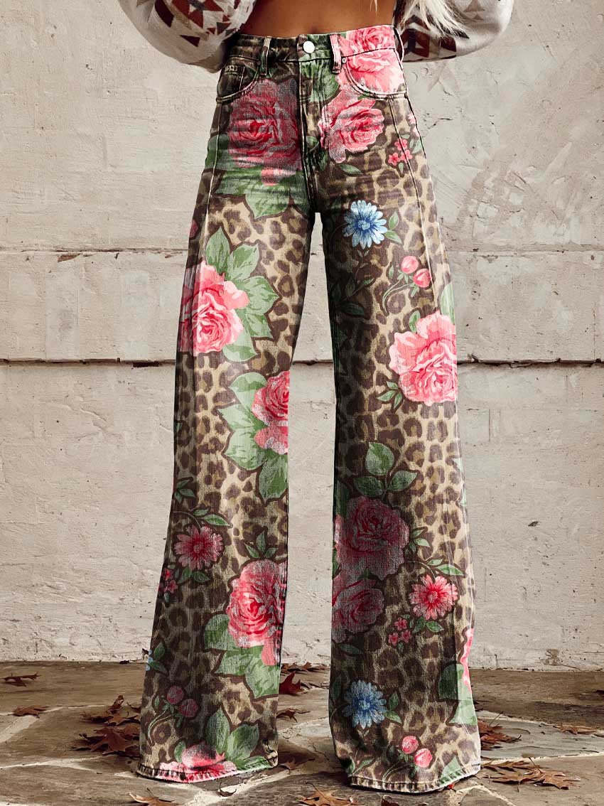 Detailed close-up of vintage floral print on women's wide-leg flare jeans, showcasing boho pattern.