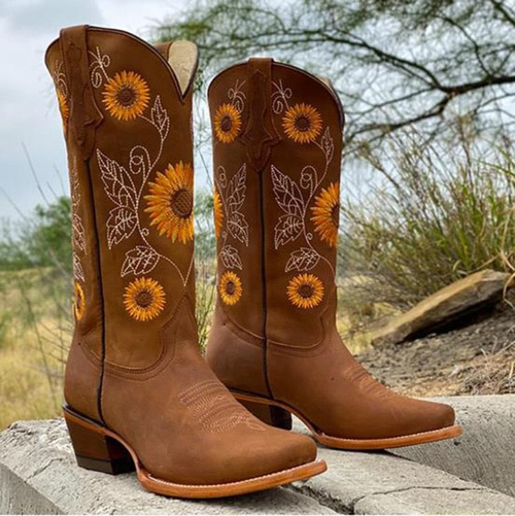Stylish women's sunflower embroidered western boots with a classic pointed toe and comfortable block heel design.