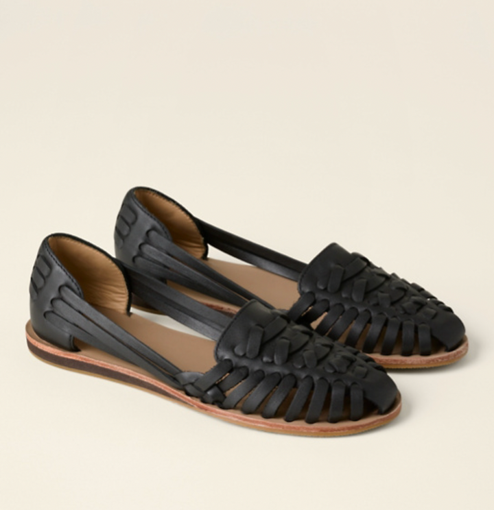 Stylish women's flat buckle sandals, showcasing a unique woven pattern, making them comfortable everyday summer shoes.