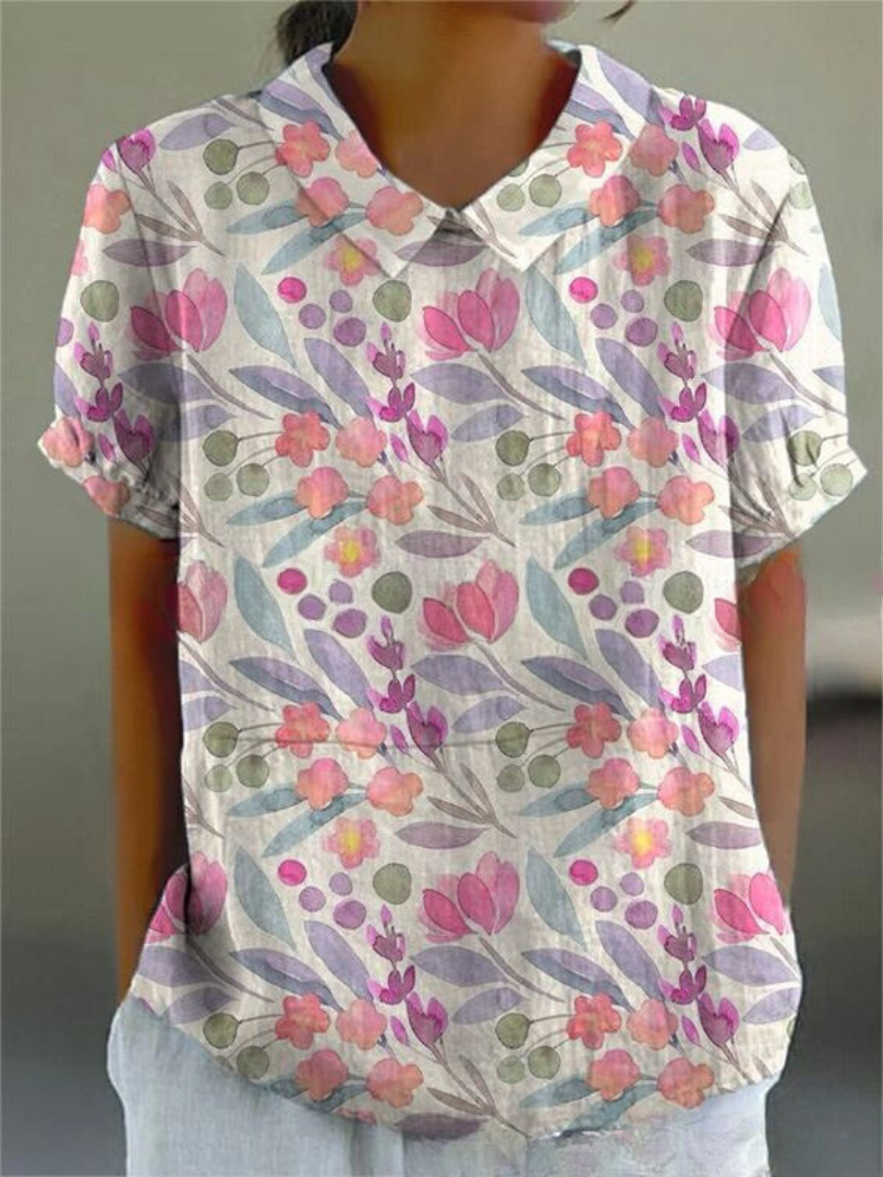 Women's blouse with short gathered sleeves, pointed collar, relaxed fit, perfect for spring-summer style and comfort.
