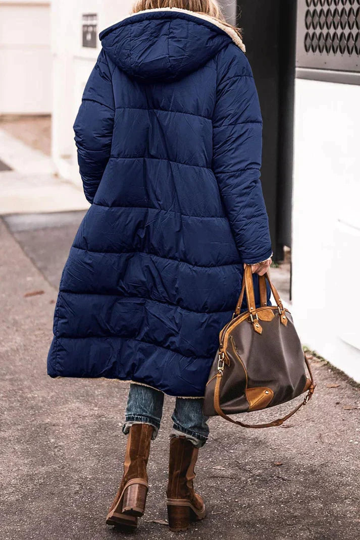 "Women's hooded longline quilted winter coat, front view; insulated, open front design with quilted texture and hood."