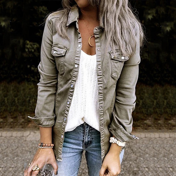 Women's lightweight denim shirt jacket with button front, structured silhouette, and chest pockets for a casual chic look.